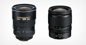 Two Nikon camera lenses are standing upright side by side against a white background. The left lens is marked "AF-S DX NIKKOR 12-24mm," and the right lens is marked "NIKKOR DX 16-50mm.