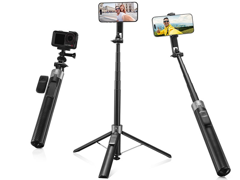 Three black selfie sticks are shown: one holding a GoPro camera, and two holding smartphones with people on the screens. One selfie stick is extended with a tripod base, while the others are handheld.