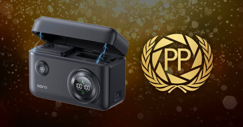 A black, rectangular electronic device with a digital display and an open lid emits blue sparks. Next to it is a gold "PP" emblem surrounded by a laurel wreath on a sparkling brown background.