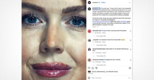 Close-up of a woman's face, focusing on her blue eyes, nose, and lips. Her skin texture and light makeup are visible, with no background details shown. The image is detailed and sharply focused on facial features.