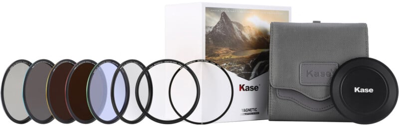 A set of Kase camera lens filters arranged in a row, shown with a gray carrying pouch, a magnetic lens cap, and a box featuring a mountain landscape image.