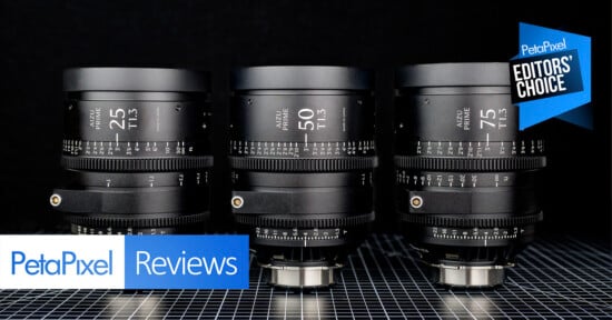Three black camera lenses are arranged side by side on a grid-patterned surface, with “Petapixel Reviews” and “Editors' Choice” badges displayed in the image corners.