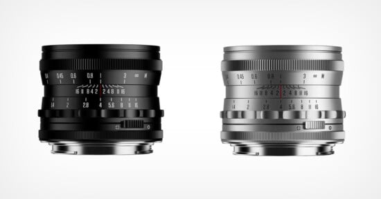 Two camera lenses are shown side by side against a white background; the left lens is black with white and orange markings, and the right lens is silver with black and red markings. Both feature manual focus and aperture rings.