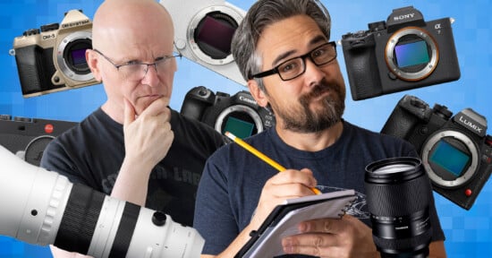 Two men, one thinking and one writing on a notepad, are surrounded by various camera bodies and lenses against a blue background. The scene suggests evaluating or comparing cameras.