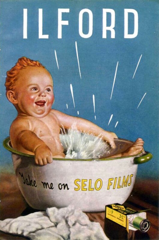 A vintage advertisement shows a smiling baby splashing in a washtub labeled "Take me on SELO FILMS." At the bottom, a box and roll of Ilford film are displayed, with "ILFORD" in large letters at the top.