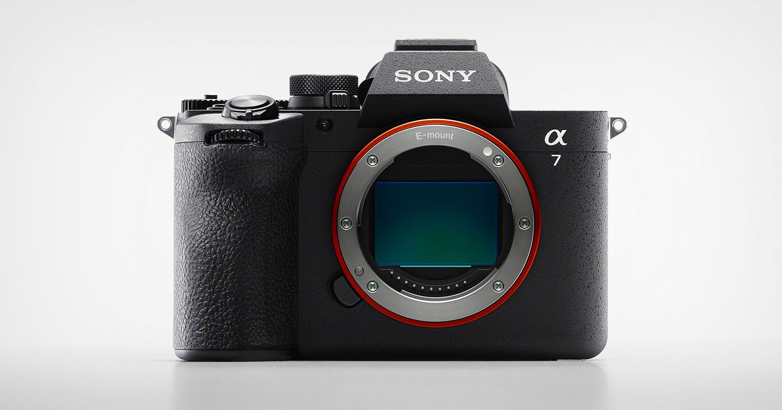 A Sony Alpha 7 mirrorless digital camera body with no lens attached, showing the large E-mount and image sensor on the front against a plain light background.