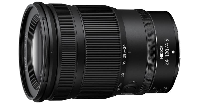 A black NIKKOR camera lens with focal length markings from 24 to 120mm and an f/4 aperture. The lens has textured grip rings and switches for focus mode and lock functions.