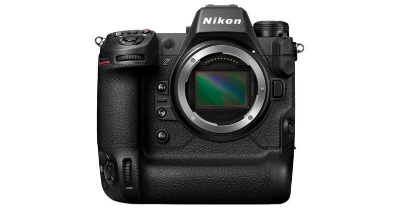 A Nikon mirrorless camera body, black, with no lens attached, showing the lens mount and image sensor. The camera has multiple buttons and a textured grip, and the Nikon logo is visible at the top.