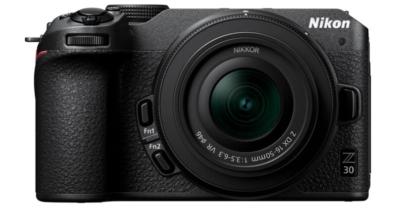 Front view of a black Nikon Z30 mirrorless digital camera with a NIKKOR Z DX 16-50mm lens attached. The camera features a textured grip and several control buttons visible on the body.
