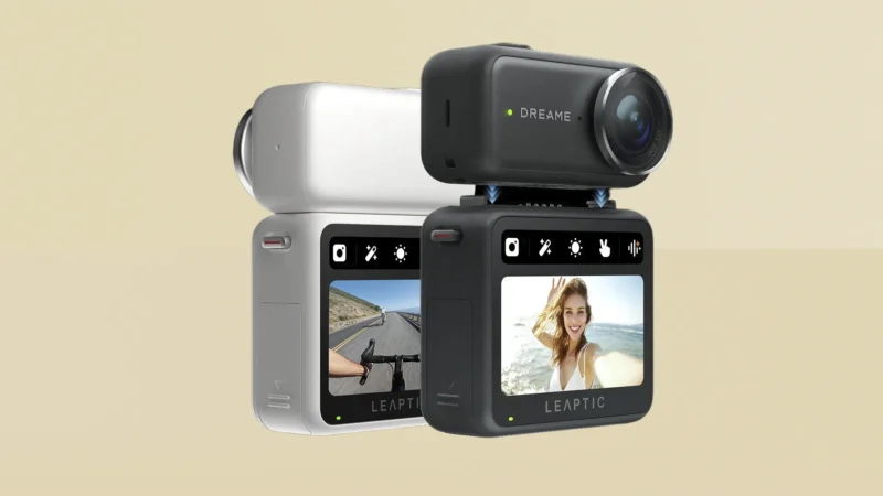 Two compact action cameras are stacked, each displaying a screen; one shows a person riding a bike on a road, and the other shows a woman smiling. Both cameras have lenses positioned on the top corner.