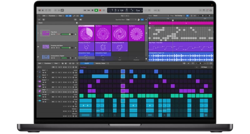 A laptop displaying music production software with various colored tracks, waveforms, and control panels on the screen, showing a digital audio workspace in use.