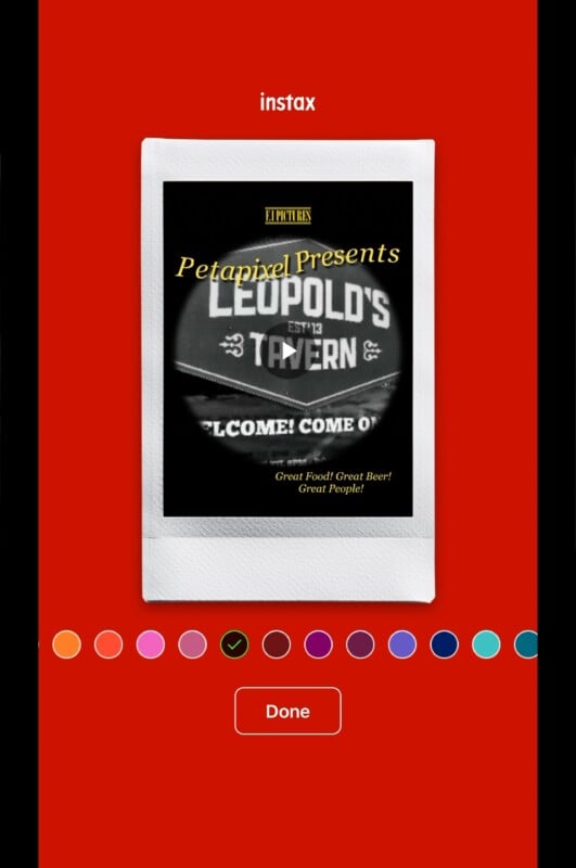 A digital Instax frame displays a photo featuring the text “Petapixel Presents” and a sign reading “Leopold’s Tavern.” The background is bright red, with color options and a “Done” button below the image.