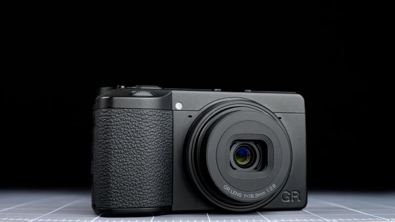 2.8” is positioned on a flat surface against a black background.