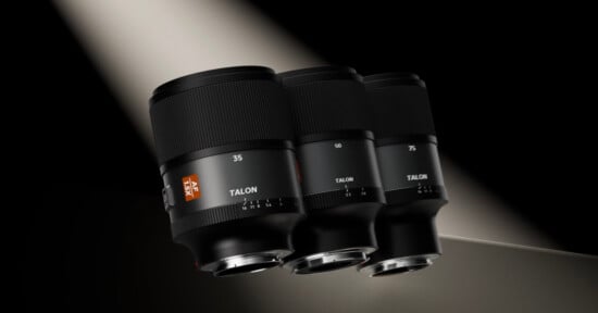 Three black camera lenses labeled 35, 50, and 75 with the brand name "Talon" are displayed side by side under a dramatic beam of light against a dark background.