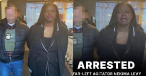 A woman in a black jacket.