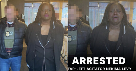 A woman in a black jacket.