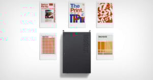 A black Instax camera sits at the center, surrounded by five instant photos with modern, graphic design posters labeled “Before the Flip,” “The Print,” “Swiss,” and “Bauhaus” on a white background.