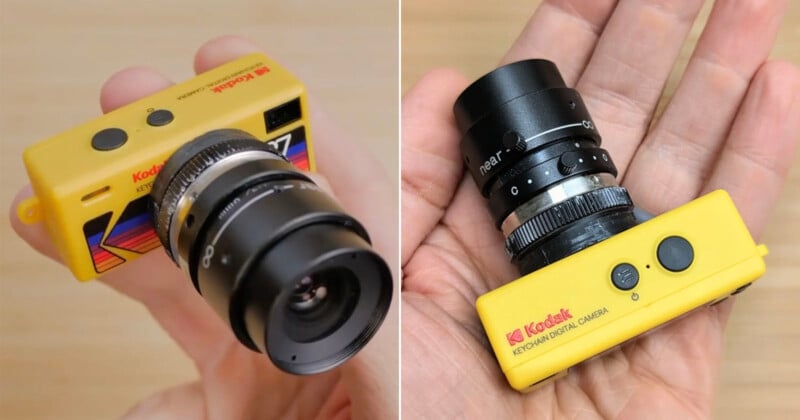 A person holds a small, yellow Kodak keychain digital camera with a large black lens attached, showing the camera from two different angles against a wooden background.