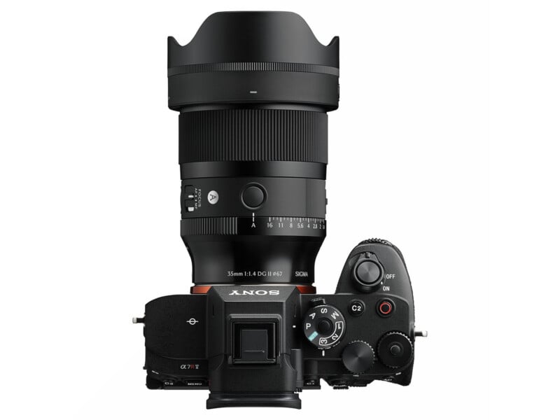 Top-down view of a digital camera with a large attached lens. The camera has the Sony logo and various control dials, while the lens is labeled "35mm F1.4 DG HSM | ART" and "SIGMA.