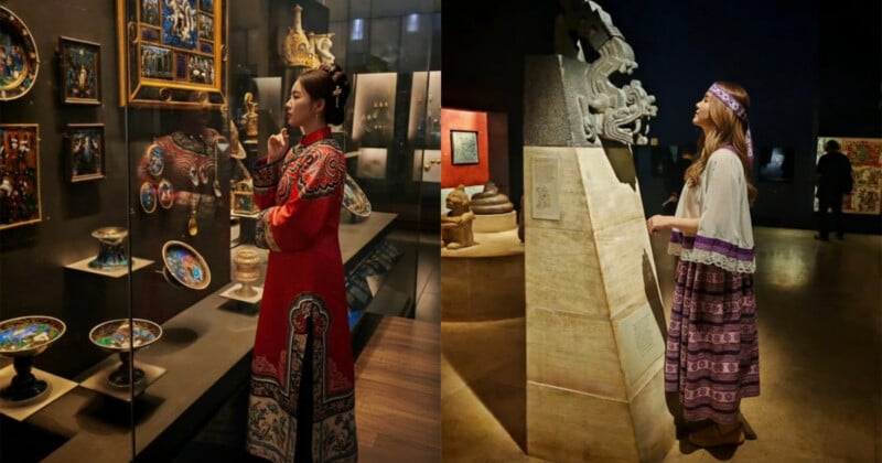 Two women in traditional clothing admire artifacts in a museum; one wears a red embroidered gown and studies ornate plates and paintings, while the other in a purple outfit observes a large stone sculpture.