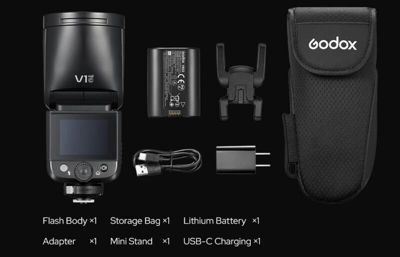 A Godox V1 camera flash kit displayed on a black background, including a flash body, storage bag, lithium battery, adapter, mini stand, and USB-C charging cable, all neatly arranged with labels.