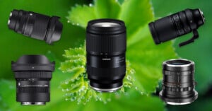 Five different camera lenses are displayed against a close-up background of a green leaf with water droplets. The lenses vary in size and brand, and are arranged around the center of the image.
