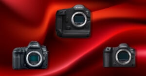 Three Canon DSLR camera bodies without lenses are displayed on a vibrant red gradient background, arranged in a triangular pattern.