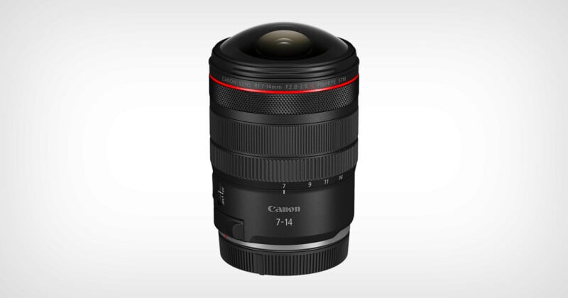 A Canon RF 7-14mm camera lens with a wide, rounded glass front element, black body, red ring near the top, and white text displaying focal length and brand, against a plain light background.