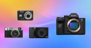 Four digital cameras are displayed against a colorful gradient background, ranging from compact point-and-shoot models on the left to a large Sony mirrorless camera on the right.