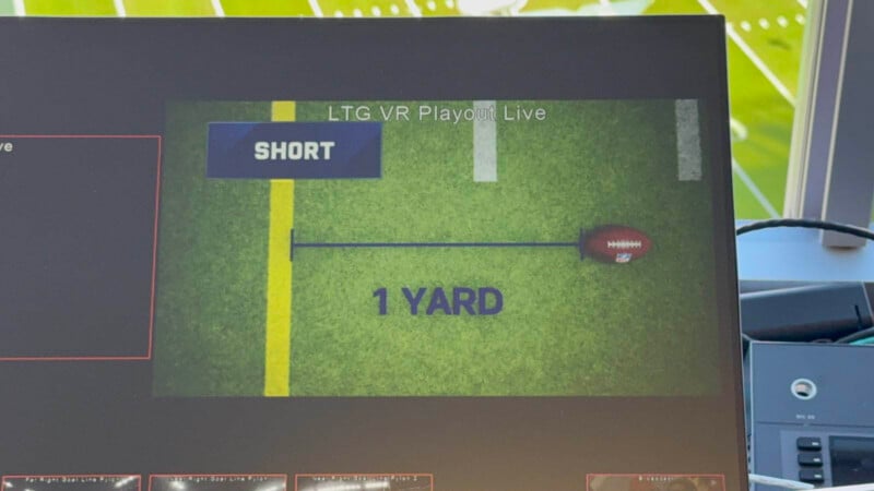 A graphic on a football field background shows a football next to a line labeled "SHORT" with the text "1 YARD" indicating the distance to the first down marker.