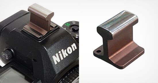 A metal accessory shaped like a miniature railroad rail, shown installed on the hot shoe of a Nikon camera on the left, and separately on the right against a white background.