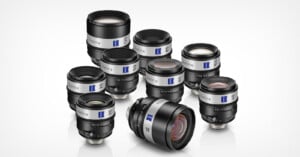 Eight Zeiss Supreme Prime camera lenses arranged in a group on a white surface, showcasing different focal lengths with black bodies, silver accents, and blue Zeiss logo labels.