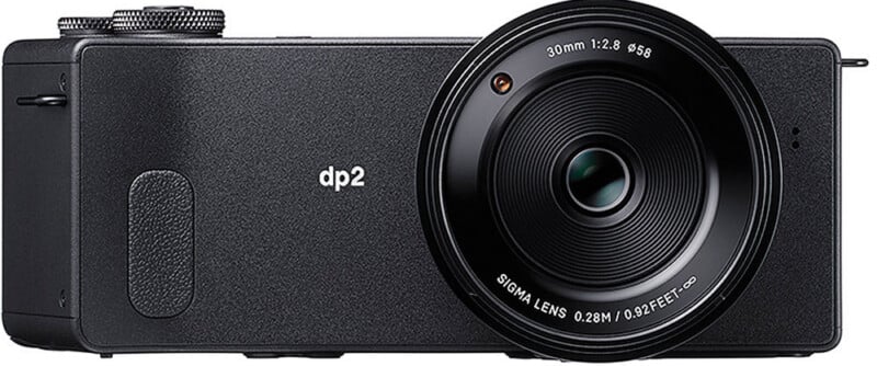 2.8" and "SIGMA LENS 0.28M/0.92FEET" text, and a minimalistic body design.