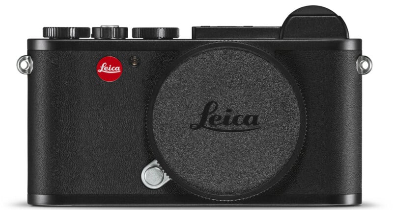 A black Leica digital camera with a textured body, prominent lens mount cover, and red Leica logo on the front, viewed from the front.