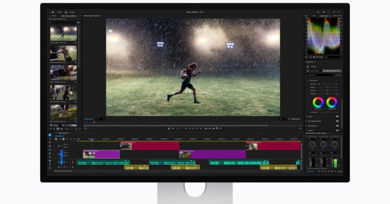 A computer monitor displays video editing software with a scene of a football player running in the rain on the main screen, surrounded by editing timelines, video thumbnails, and color grading tools.