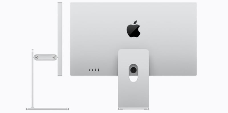 Side and back views of a silver Apple iMac desktop computer, showing its thin profile, built-in stand, and Apple logo centered on the back. The stand has a circular hole for cable management.