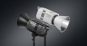 Two professional studio lights, one black and one white, with the brand name "Litetons LE200D" displayed on each. The lights have large reflectors and are set against a dark gradient background.