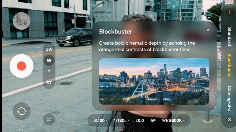 A camera app screen overlays a city street scene with a filter preview called "Blockbuster," showing a cityscape with orange and teal color grading, and camera settings displayed at the bottom.