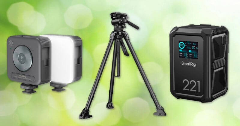Two small square LED lights, a black tripod, and a black SmallRig power station labeled "221" are displayed against a green blurred background.