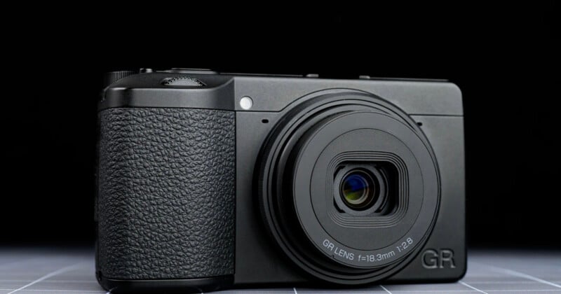 2.8," is placed on a flat surface against a dark background.