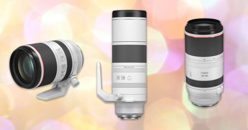 Three white Canon telephoto camera lenses are displayed upright against a soft, colorful bokeh background. Two lenses have tripod mounts attached, while the third lens does not.