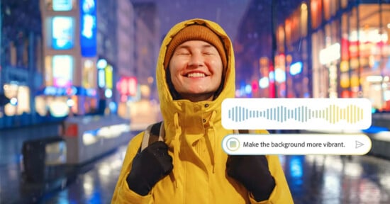 A smiling person in a yellow jacket and beanie stands on a brightly lit street at night. A digital overlay shows an audio waveform and the text: "Make the background more vibrant.
