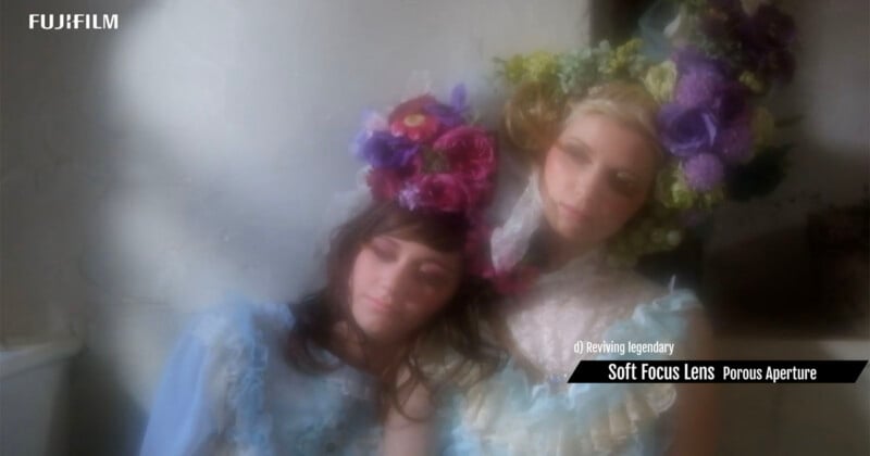 Two women in vintage-style dresses and floral headpieces pose closely together, with a dreamy, soft-focus effect. "FUJIFILM" and text about a "Soft Focus Lens Porous Aperture" appear on the image.