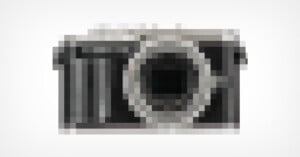 A highly pixelated image of a camera on a white background; the specific details of the camera are unclear due to the heavy blurring.