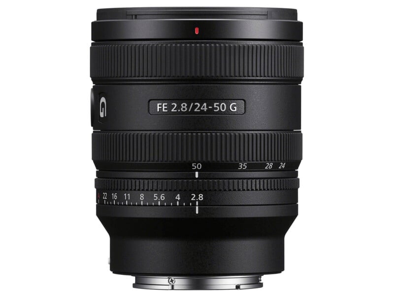 A black Sony FE 24-50mm f/2.8 G camera lens is shown upright, with focus and zoom rings, aperture markings, and the lens mount visible at the bottom.