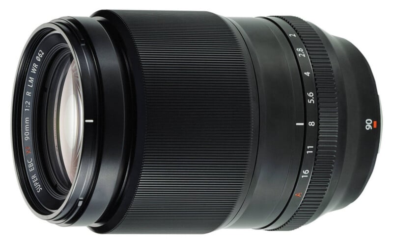 A black Fujifilm camera lens with a large front glass element, textured focus ring, and aperture markings ranging from f/2 to f/16. The lens is labeled "90mm" and "Super EBC XF 90mm 1:2 R LM WR ø62.