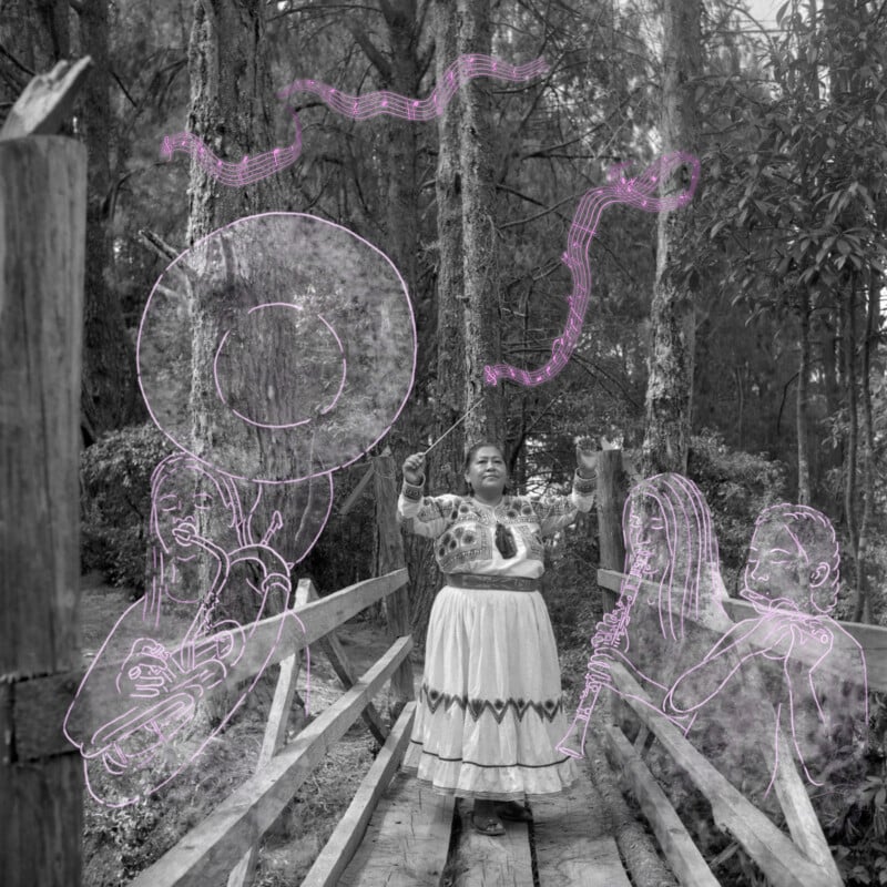 A woman in traditional dress stands on a wooden bridge in a forest, raising her arms as if conducting. Around her, pink line drawings of musical notes and musicians playing instruments are superimposed on the photo.