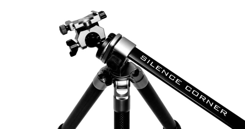 A black and silver tripod with an adjustable head is shown angled on a white background. The brand name "Silence Corner" is printed on one of the tripod's legs.