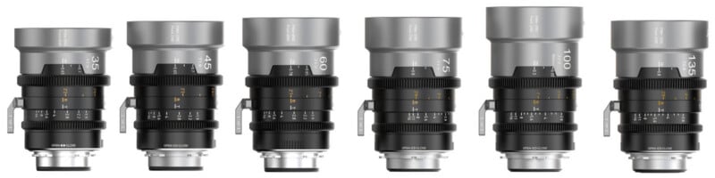 Six professional camera lenses in a row, each with different focal lengths and similar black and silver designs, featuring engraved markings and focus rings, displayed on a white background.