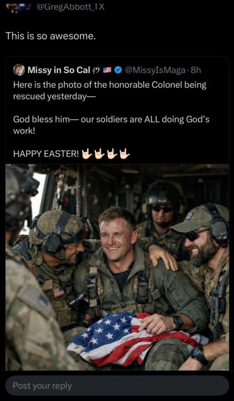 A group of smiling soldiers in camouflage gear gather around a muddy man holding a folded American flag. The atmosphere is joyful, and they appear to be celebrating a rescue.